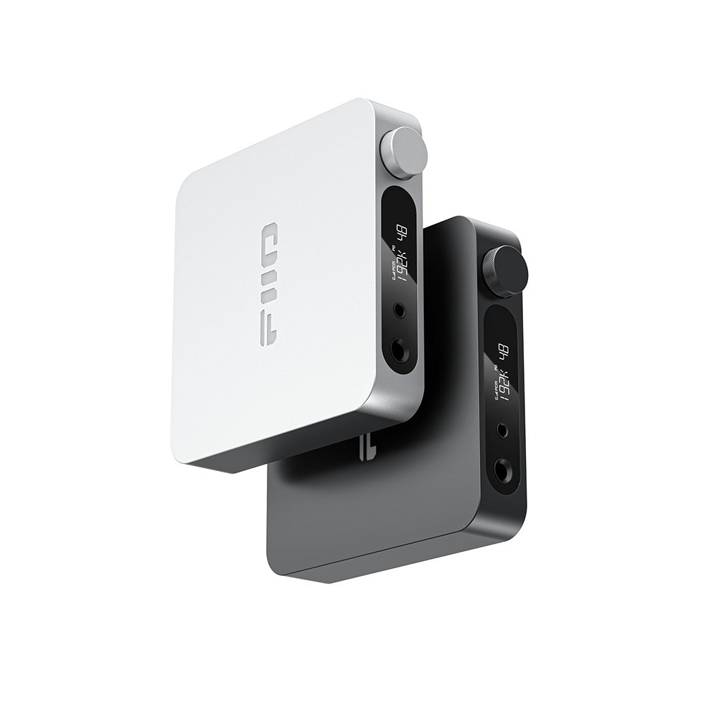 FiiO K11 silver and black units shown upright, side view of the front panels and volume knobs